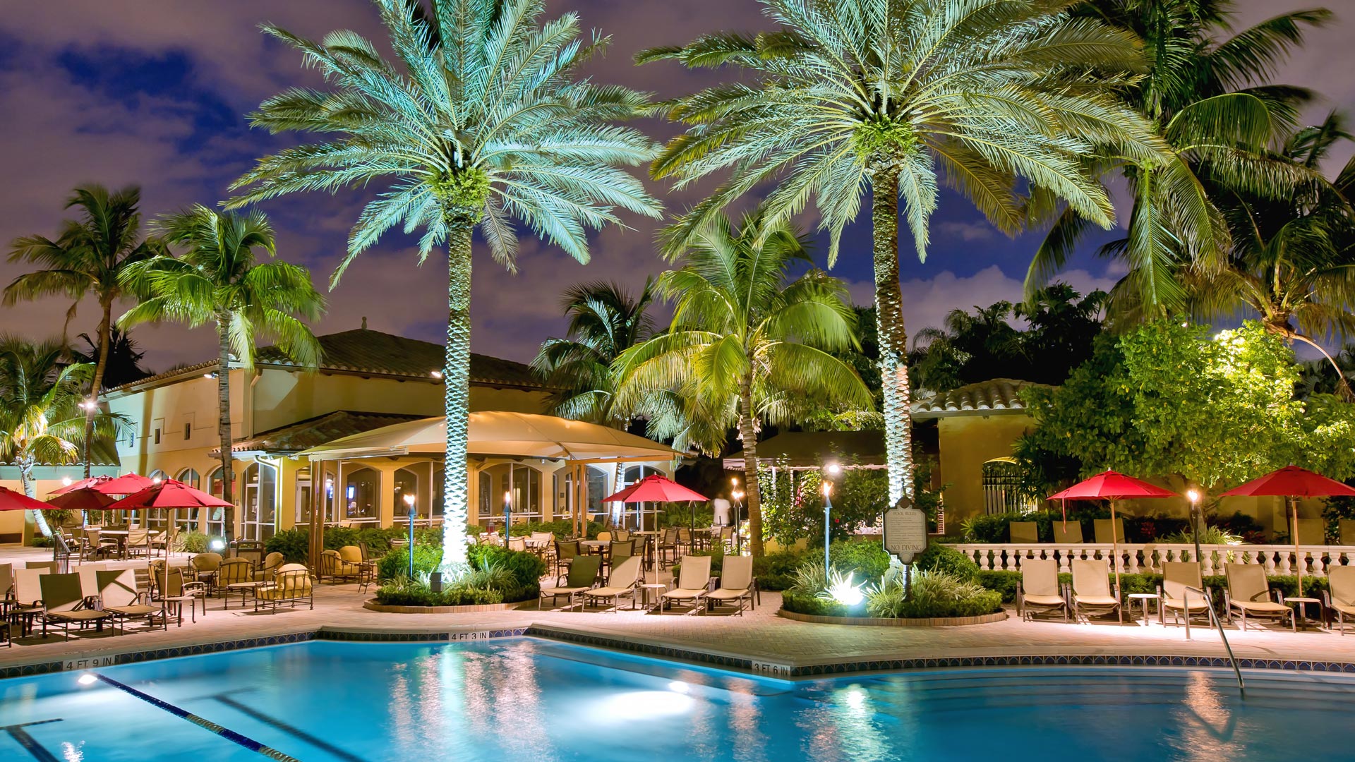 Lakewood Ranch clubhouse with pool at night